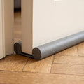 Boudin de porte double posé sous une porte